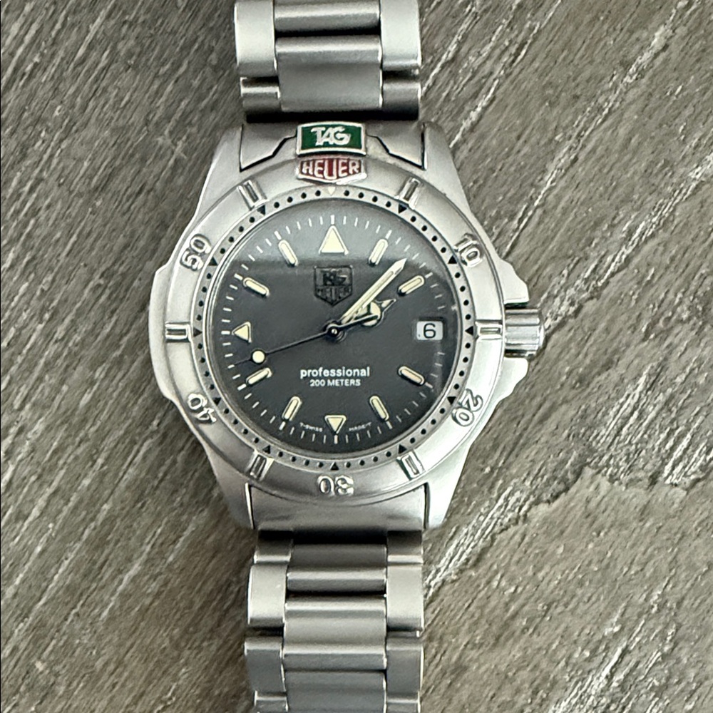 Tag Heuer Silver Watch with Black Dial